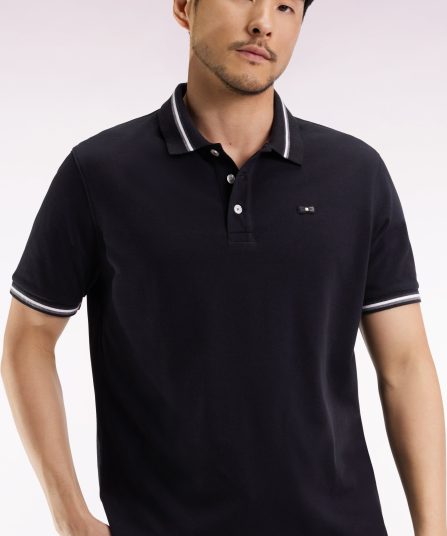 Polo manches courtes en coton noir détails rayés coupe ample