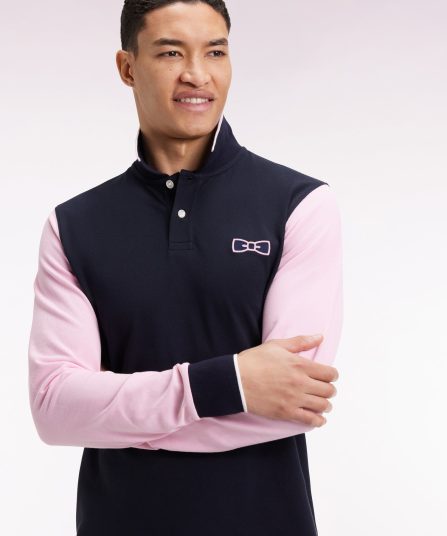 Polo à manches longues bicolore marine et rose à nœud papillon